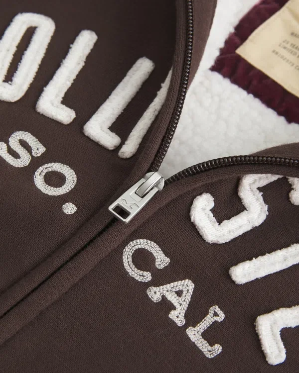 Holiday Vault Release Sherpa-Lined Zip-Up Logo Graphic Hoodie Holiday Vault Release Sherpa-Lined Zip-Up Logo Graphic Hoodie
