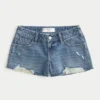 Low-Rise Distressed Medium Wash Denim Mini Shorts Low-Rise Distressed Medium Wash Denim Mini Shorts