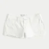 Low-Rise Distressed White Denim Mini Shorts