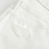 Low-Rise Distressed White Denim Mini Shorts