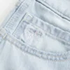 Low-Rise Light Wash Bow Graphic Baggy Jort Low-Rise Light Wash Bow Graphic Baggy Jort