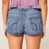Ultra Low-Rise Distressed Medium Wash Denim Mini Shorts
