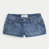 Ultra Low-Rise Distressed Medium Wash Denim Mini Shorts