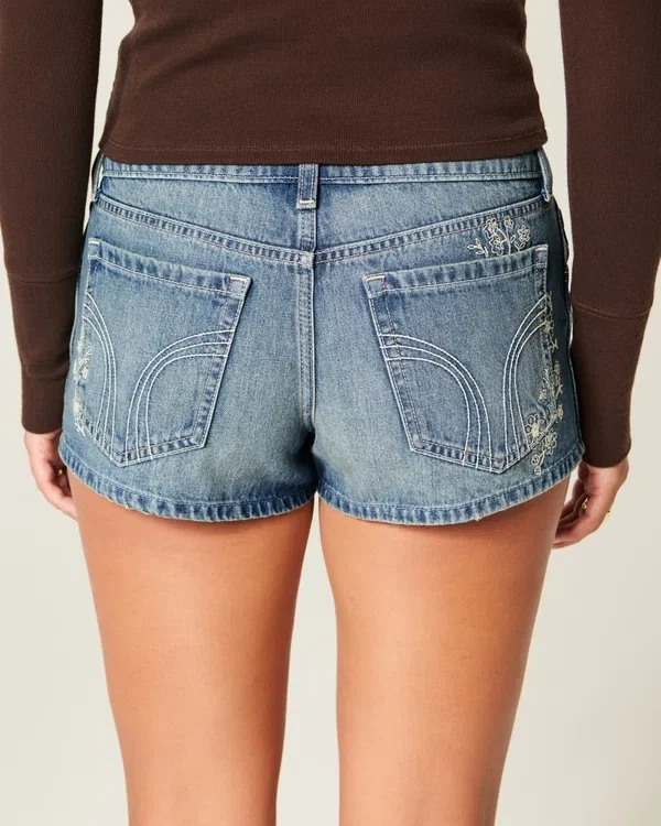 Ultra Low-Rise Medium Wash Floral Embroidered Denim Mini Shorts Ultra Low-Rise Medium Wash Floral Embroidered Denim Mini Shorts